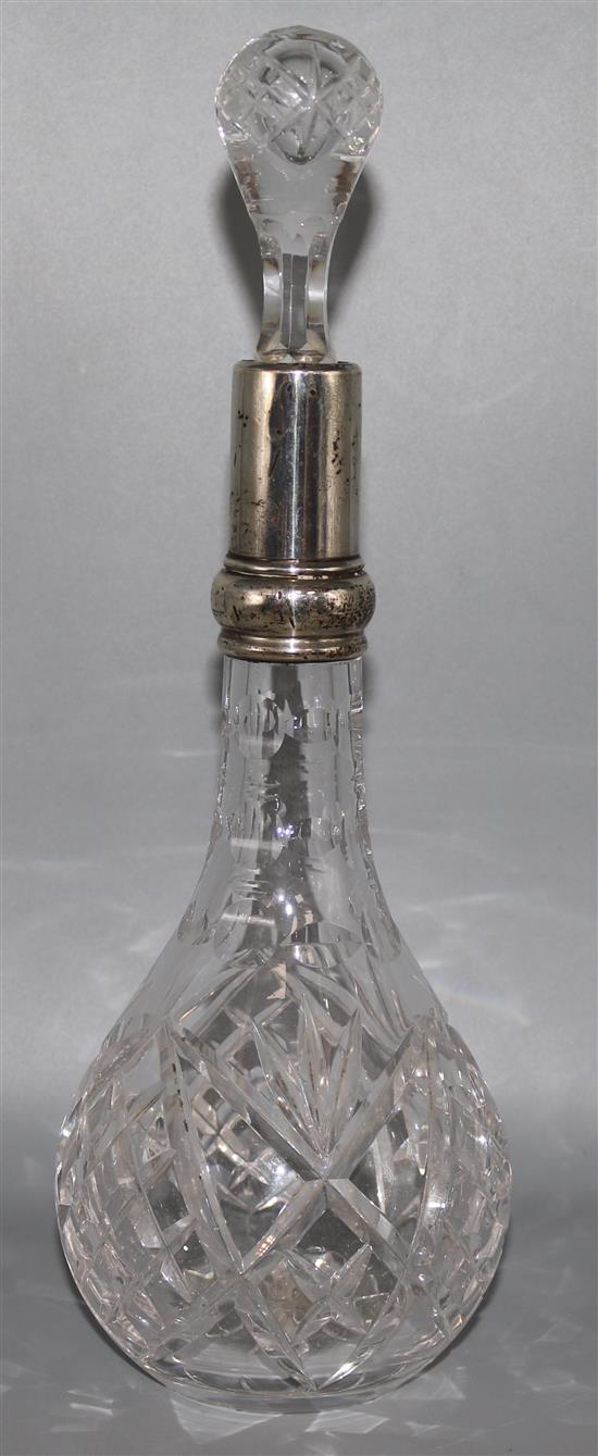 A silver mounted cut glass decanter and stopper, 12in.